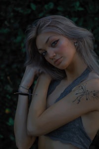 a woman with a tattoo on her arm